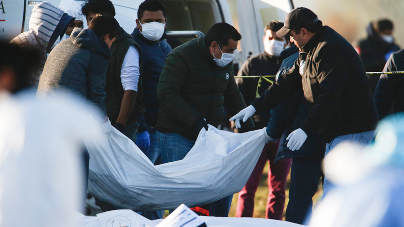 Forensic examiners removing bodies after a gas explosion in Hidalgo state, Mexico, on Jan. 19, 2018.